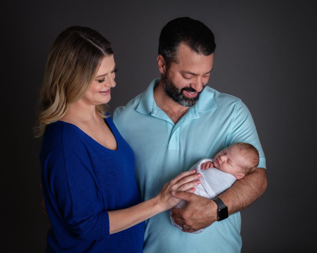 new parents holding newborn son, Poway, California