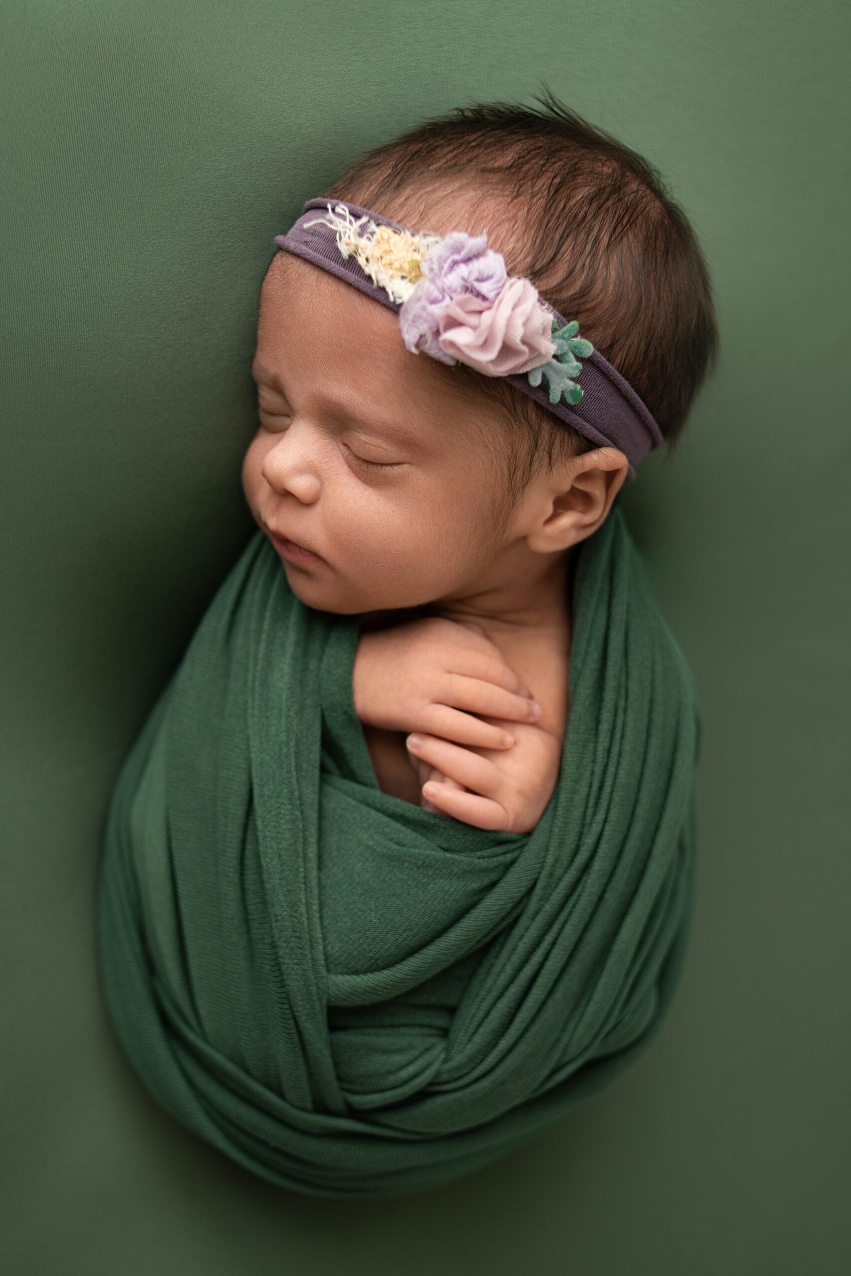 Timeless newborn portrait of a baby girl photographed in a San Marcos studio